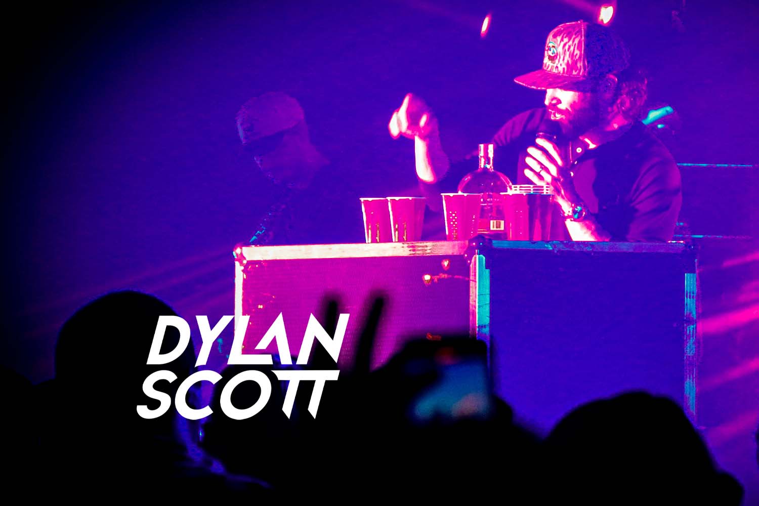 Dylan Scott Logo with picture of Dylan Scott while he was performing at The Orion Event Center November 2024.